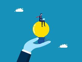 Thinking of creating. Businessman with laptop on creative light bulb vector