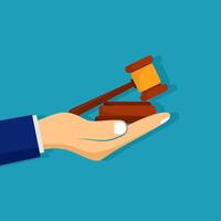 hand holding a gavel and a judge's gavel flat design vector