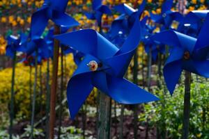 Close-up of plastic Blue Pinwheel in amusement park. Abstract Background of ornament in amusement park. Graphic Resources. Macro Photography. Travel Destinations. Holiday photography concept photo