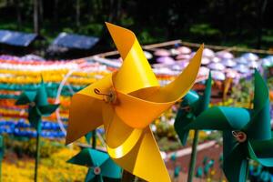 Close-up of plastic Yellow Pinwheel in amusement park. Abstract Background of ornament in amusement park. Graphic Resources. Macro Photography. Travel Destinations. Holiday photography concept photo