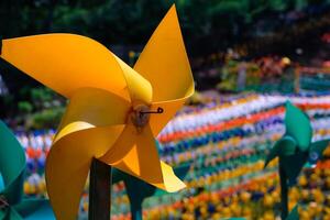 Close-up of plastic Yellow Pinwheel in amusement park. Abstract Background of ornament in amusement park. Graphic Resources. Macro Photography. Travel Destinations. Holiday photography concept photo