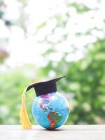 Earth globe with graduation hat. Copy space for text, Back to school, Education concept photo