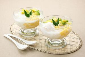 Es teler or es teller, Indonesian dessert, consist of avocado, young coconut, jackfruit, served with coconut milk or sweetened condensed milk. photo