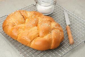 Roti Manis Ayam, sweet bread filled with shredded chicken and sesame seed photo