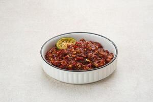 Sambel or Sambal Terasi is traditional food which is popular in Indonesia. Made from tomatoes, chilies, salt, sugar, garlic, shallots and shrimp paste photo