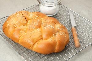 Roti Manis Ayam, sweet bread filled with shredded chicken and sesame seed photo