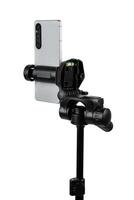 Smartphone mounted on a tripod. Stable photo or shooting for a blog or social media content. Isolate on a white back.