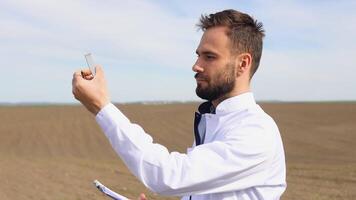 Scientist checks the quality of the soil for control soil quality before seed plant. Future agriculture concept. Smart farming, using modern technologies in agriculture video