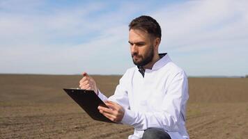 Scientist checks the quality of the soil for control soil quality before seed plant. Future agriculture concept. Smart farming, using modern technologies in agriculture video