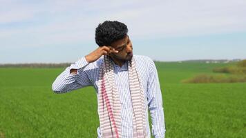 Tired indian farmer on his wheat field video