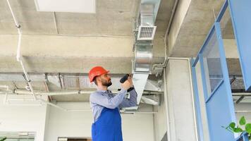 Hvac worker install ducted pipe system for ventilation and air conditioning video