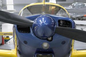 Propeller on light aircraft close-up, screws, texture, blue color surface photo