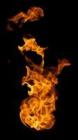 Fire and burning flame of explosive fireball isolated on dark background for abstract graphic design photo