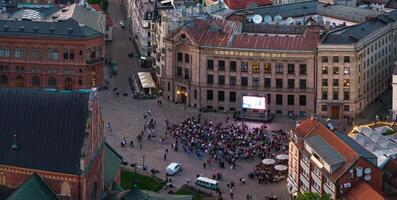 Aerial View of Crowd in Riga City Square with Latvijas Radio Building photo