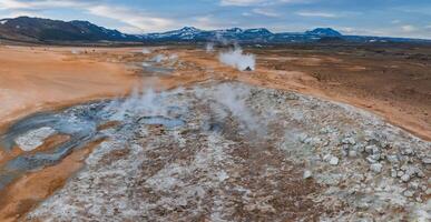 Aerial View of Steaming Geothermal Area in Iceland's Barren Landscape photo