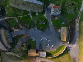 Aerial View of Historical Village with Wooden and Stone Structures in Iceland photo