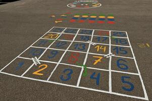 a large play area with numbers and numbers painted on the ground photo