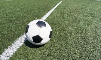 Black and white soccer and football ball in the field. Horizontal sport theme poster, greeting cards, headers, website and app photo
