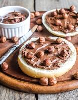 Bun slices with chocolate cream and nuts photo