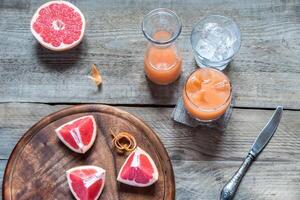Grapefruit fresh on the wooden table photo