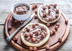 Bun slices with chocolate cream and nuts photo