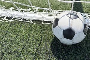 Goal in the back of net in soccer game photo