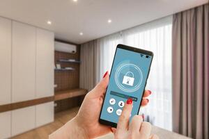 Mobile phone with app smarthome intelligent house automation remote control technology concept photo