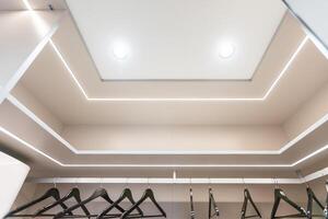 Fragment of a stretch ceiling with the hidden LED illumination photo