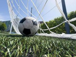 Goal in the back of net in soccer game photo