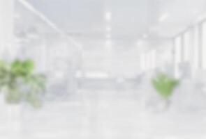 Blurred empty open space office. Abstract light bokeh at office interior background for design. photo