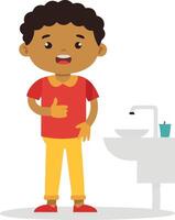 Boy giving a thumbs up while standing by a sink vector