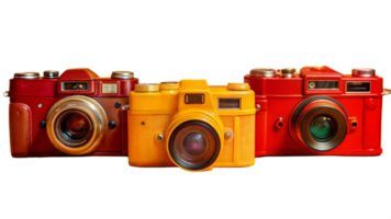 Three cameras of different colors are lined up on a transparent background png