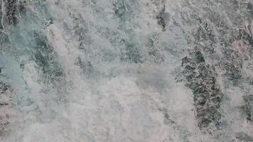 Close-Up of Cascading Waterfall, A detailed view of a waterfall in motion, showcasing the powerful flow and frothy white water. video