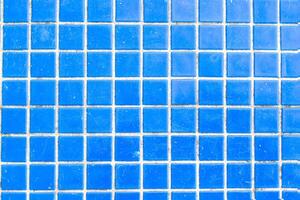 Texture of blue mosaic tiles, close-up photo