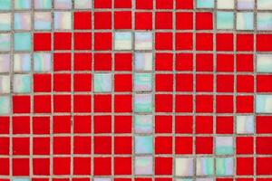 Texture of red mosaic tiles, close-up photo