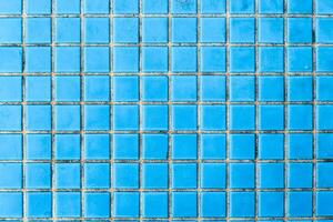 Texture of blue mosaic tiles, close-up photo