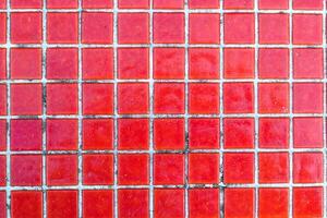 Texture of red mosaic tiles, close-up photo