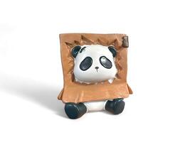 Decorated miniature panda in cardboard on a white background photo