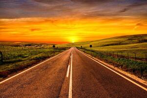 As the sun sets, the backdrop image displays a charming sight of nature, with the sky bending gently towards the horizon photo