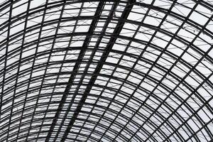 Abstract view to hemispherical ceiling of glass and metal in modern building as background, texture photo