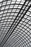 Perspective view to semispherical ceiling of glass and metal in modern building as background, texture photo