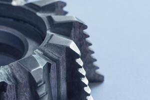 Close up view of a fragment of steel milling cutter on white background with copy space photo