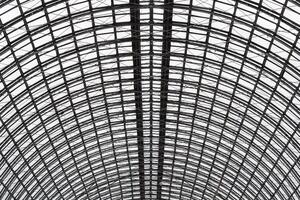 Wide angled view to hemispherical ceiling of glass and metal in modern building as background, texture photo