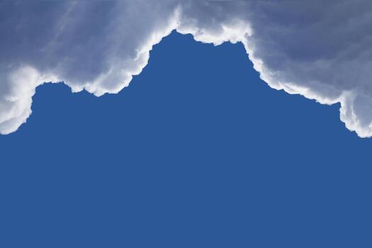 Framing on top from the fluffy clouds with highlighted edges in the deep blue sky with copy space photo