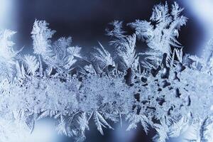 Frost pattern on the glass. Abstract, background, texture photo