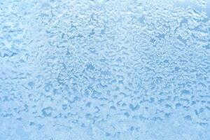 Azure frosty pattern on the glass as background. Abstract, copy space, texture photo