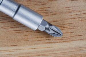 Screwdriver on a wooden table. Close up photo