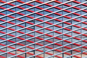 Front view of a fragment of modern building of glass and metal as texture photo