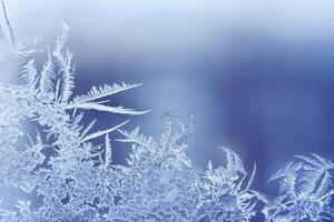 Frosty pattern on the glass window with copy space. Abstract, background, toned photo