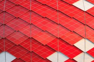 Red and white facade of modern building with geometric pattern as background, texture, abstract photo